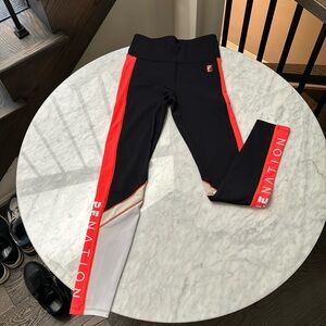 P.E. Nation high rise leggings with orange band on leg